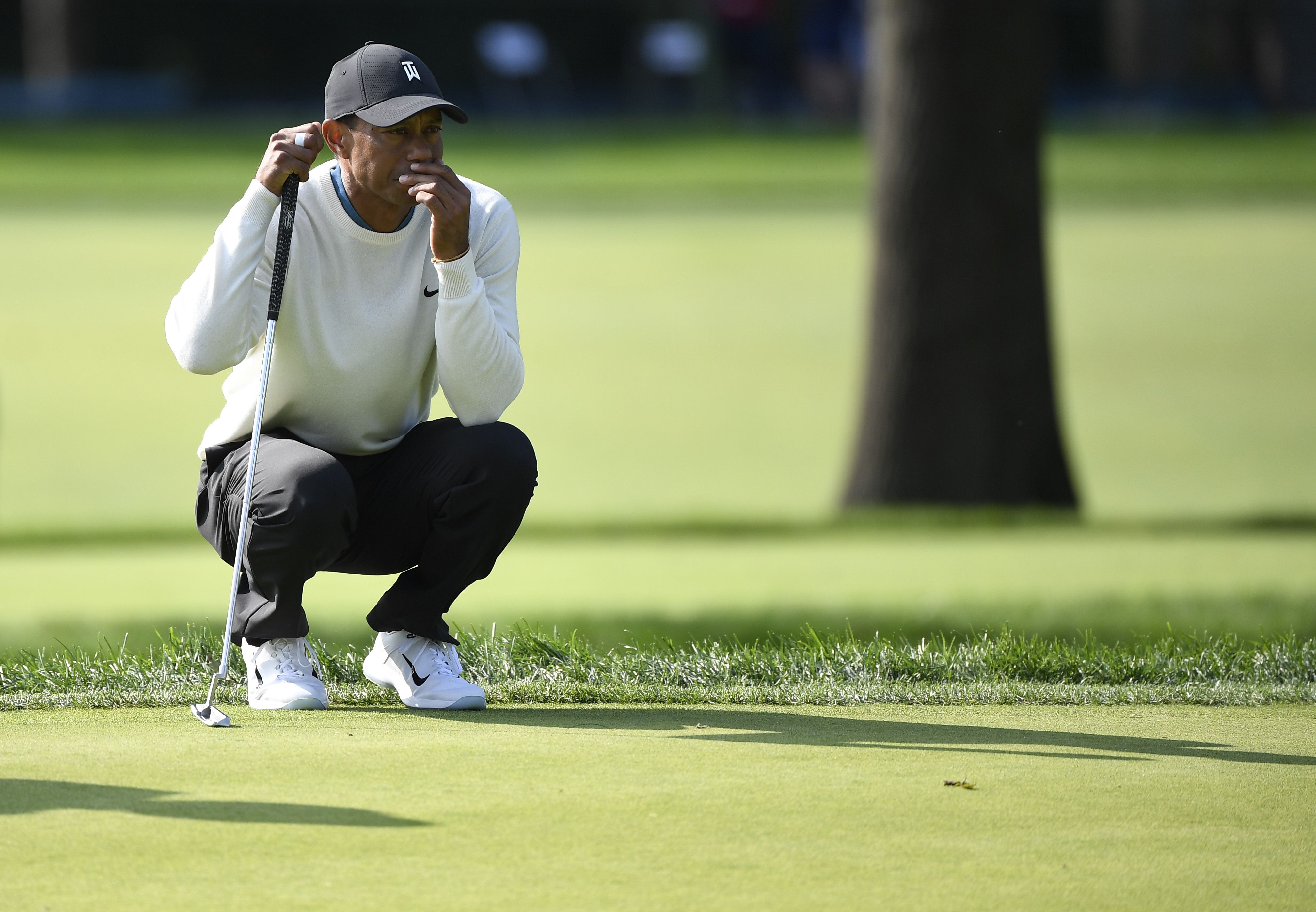 Sep 18, 2020; Mamaroneck, New York, USA; Tiger Woods looks over his putt on the 17th green during the second round of the U.S. Open golf tournament at Winged Foot Golf Club - West. Mandatory Credit: Danielle Parhizkaran-USA TODAY Sports